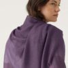 Woman Wears Featherweight Cashmere Scarf in Dark Lavender