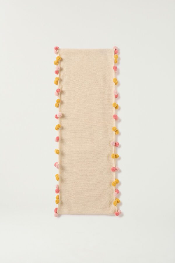 Flat lay of children's pom-pom cashmere scarf by brand KASMIRI