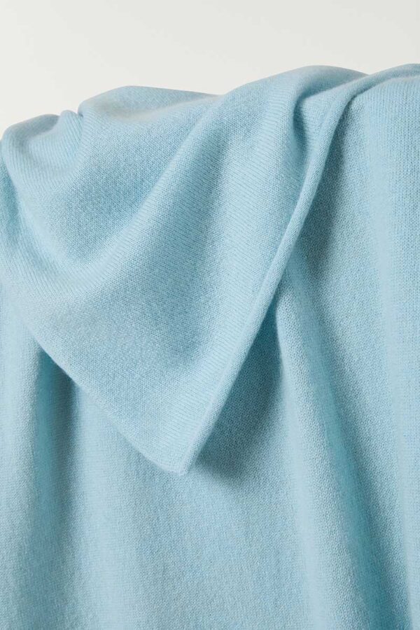 close up of cashmere travel wrap in sky blue