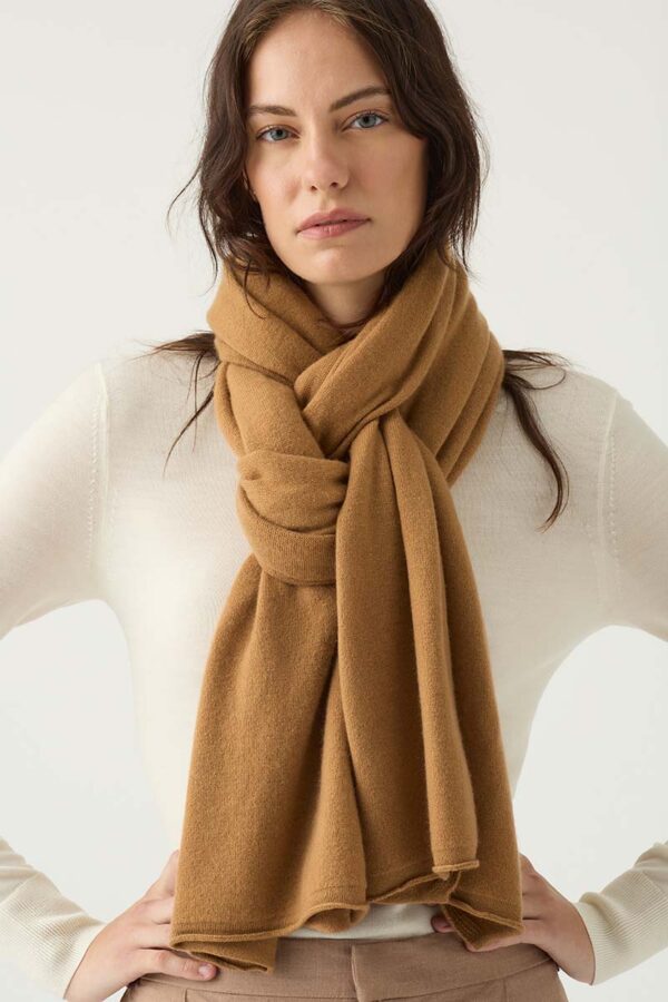 Woman Wears Cashmere Travel Wrap in Spice