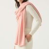 Woman wears Cashmere Travel Wrap in Ballerina Pink