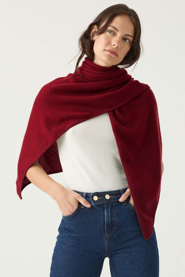 Woman wears Tibetan Red Soft Cashmere Triangle Scarf around her shoulders for warmth and comfort