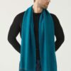 Man wears The Gatsby Cashmere Scarf in Peacock
