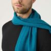 Man wears The Gatsby Cashmere Scarf in Peacock