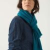 Woman wears The Gatsby Cashmere Scarf in Peacock